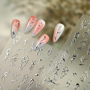 Silver metallic nail art stickers featuring abstract flame and star patterns for women