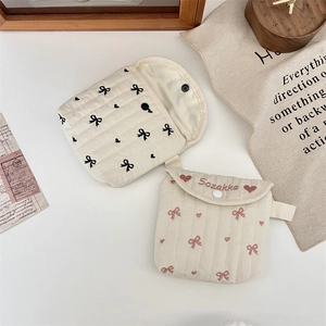 Quilted cotton storage pouch with bow embroidery and secure snap button closure