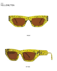 Cat eye blue light blocking glasses with yellow ink splatter frames and tea lenses