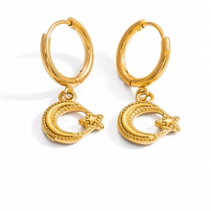 Close-up of 18k gold plated stainless steel hoop earrings with star and moon charms