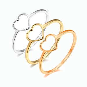 Detailed trio of gold, silver and rose gold heart cutout rings in polished steel