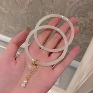 Elegant milky white 2-piece bracelet set with golden butterfly and pearl charms