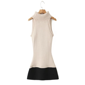 Detail of high-neck sleeveless knit dress with ivory and black colorblock texture