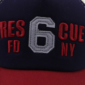 Detail of 3D embroidery and felt patch on the navy and red vintage baseball cap