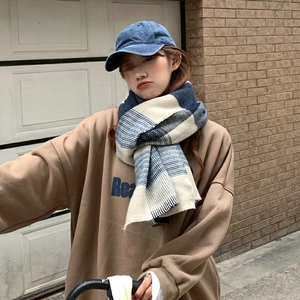 Blue and white plaid soft cashmere-like winter scarf styled with a baseball cap