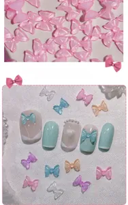 Close-up of translucent resin bow nail charms in various candy colors for manicure art