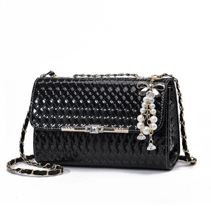 Chic black woven leather shoulder bag with gold chain strap and pearl crystal charms