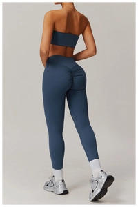 Detail view of high-waist yoga leggings with scrunch butt lifting design in smoky blue