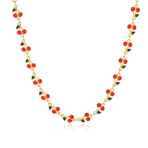 Macro shot of gold stainless steel necklace featuring red cherries and green leaves charms