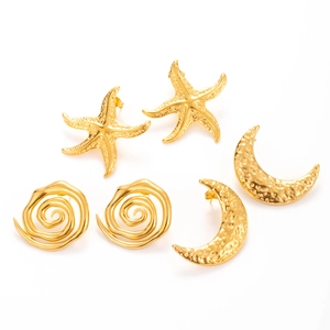 Three-piece set of gold stainless steel stud earrings with starfish, moon and spiral designs