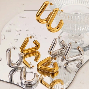 Minimalist geometric hollow triangle and U-shaped metal earrings in gold and silver