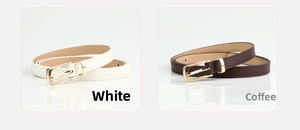 Detail view of stylish thin PU leather belts in white and brown with gold pin buckles