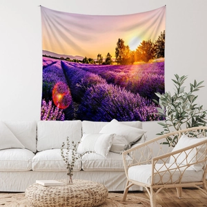 Detail of lavender sunset tapestry hung over a modern sofa in a cozy living room decor