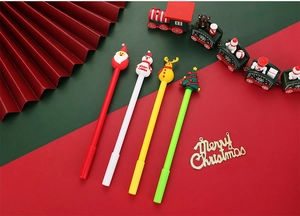 Close-up of 4 Christmas cartoon gel pens with Santa, snowman and reindeer toppers