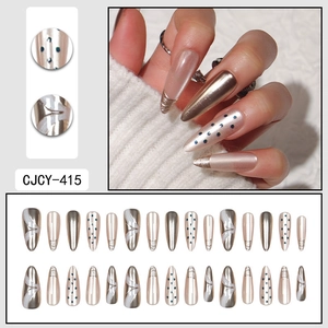 French manicure press-on nails with metallic champagne gold and blue polka dot patterns