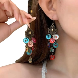 French vintage style bow pearl tassel earrings on model in high-quality side view