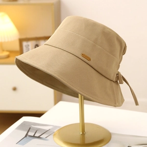 Elegant khaki cotton bucket hat for women with golden label and bow tie detail