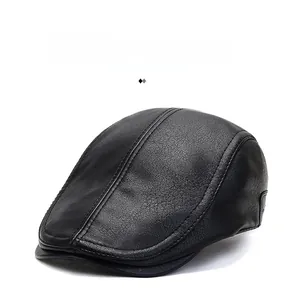 Close-up of black faux leather cap featuring detailed stitching and litchi texture finish