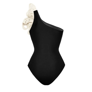 Detail of elegant black one-piece swimsuit featuring a 3D white laser-cut floral shoulder design