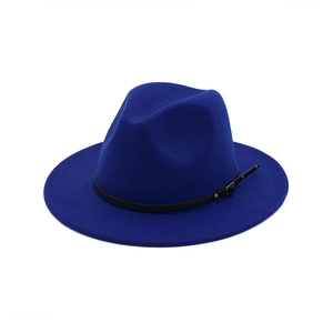 Close-up of royal blue wool fedora hat featuring black leather band and gold metal buckle