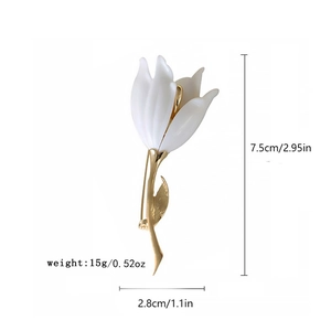 Detailed view of a white flower brooch with golden stem including dimensions and weight