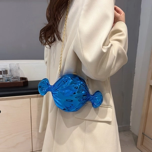 Blue candy-shaped acrylic handbag with glossy finish and gold chain strap for women