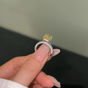 Close-up of S925 silver ring featuring a large yellow square gem with pavé diamonds