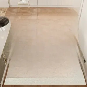 Detailed close-up of beige French PVC entry mat with modern black grid pattern