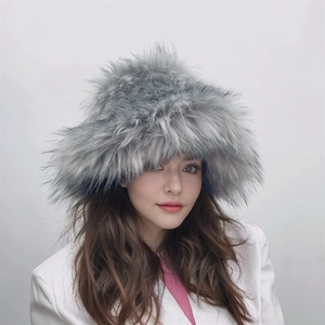 Detailed close-up of a grey faux fur bucket hat featuring long plush texture on a model