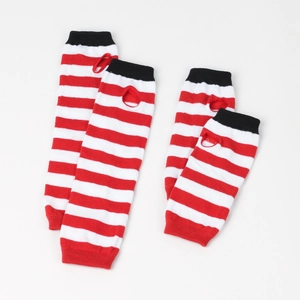 Detail of red and white striped knitted arm warmers and matching stockings with thumb holes