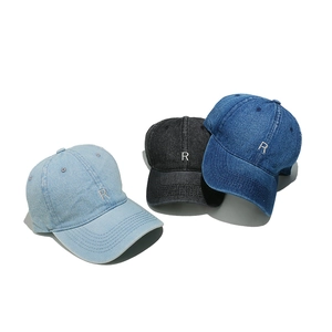 Three washed denim baseball caps with R embroidery in light blue, black, and navy colors