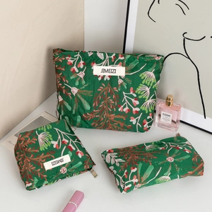 Ensemble de trois trousses à maquillage à motif floral vert en trois tailles pour voyage