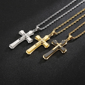 Macro shot of stainless steel cross pendants with brushed texture and twist rope chains