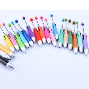 Detailed close-up of colorful DIY beadable ballpoint pens arranged in a fan-like layout