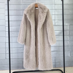 Long faux fur coat in beige featuring a classic lapel and thick high-density texture