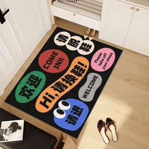 Colorful speech bubble PVC doormat on wooden floor at home entrance with shoe rack