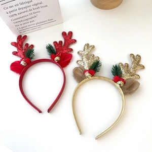Christmas reindeer antler headbands with glitter, pine branches and bells on white background