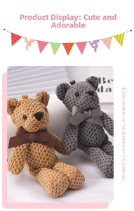 Detail of knitted plush bear pendants in brown and grey with cute ribbon bow ties