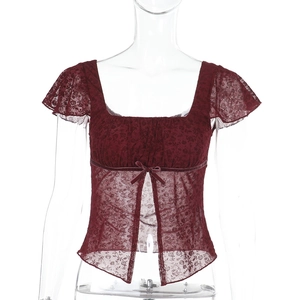Detail view of burgundy square-neck lace top featuring bow accent and front slit hem