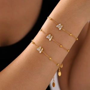 Elegant 18K gold-plated butterfly bracelet set with white mother-of-pearl and zirconia