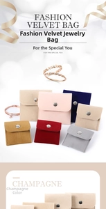 Close-up of velvet jewelry pouches in multiple colors with circular metal snap fasteners