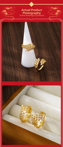 Detail of adjustable gold-plated ring featuring marquise-cut zircons in a wheat ear design