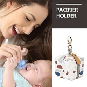 Waterproof leather pacifier holder bag with terrazzo pattern and metal hook for stroller