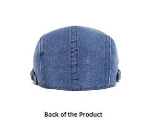 Back view of vintage dark blue washed denim beret with orange stitching and metal buckle