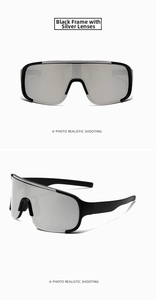 Detail view of sports sunglasses featuring black frames and silver mirror lenses