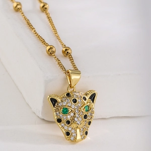 Detailed close-up of 18K gold plated leopard head pendant with sparkling crystals