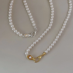 925 silver pearl necklace with unique gold and silver eye-shaped clasp details