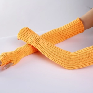 Close-up of yellow knitted arm warmers with a vertical ribbed pattern and fingerless design