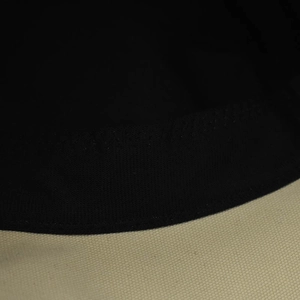 Detailed macro view of the interior black sweatband and beige cotton canvas stitching