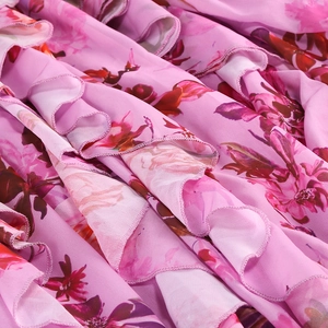 Detail of pink floral fabric showing light tiered ruffles and fine stitching texture